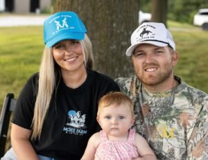 Cole McBee and Kacie Adkison with their babya