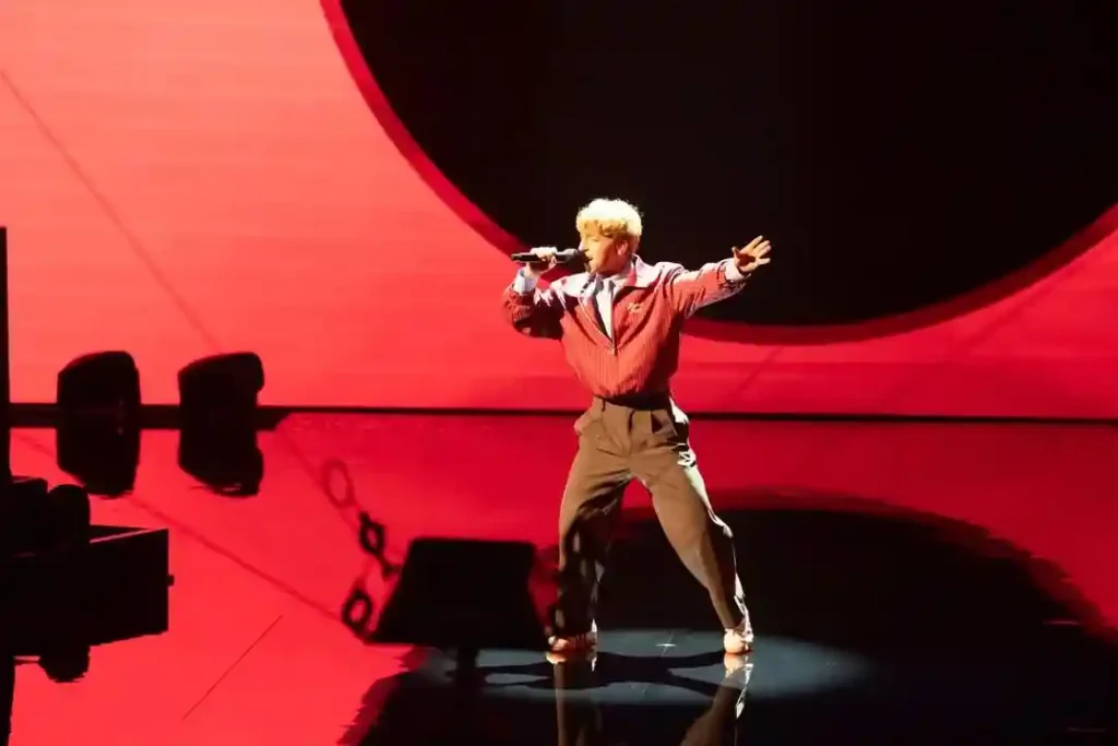 John STandley on Red Background Performing